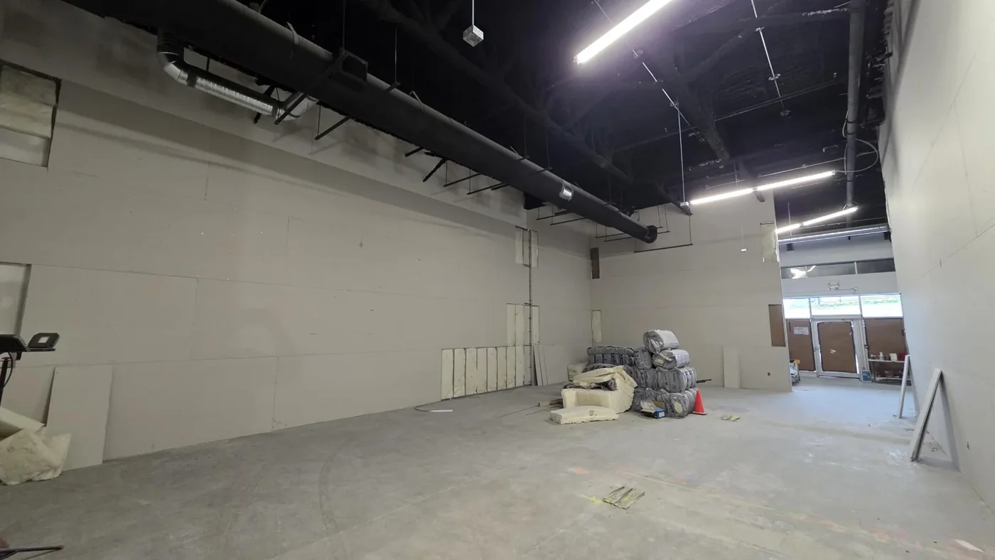 Boarded retail partitions at Club Champion, Surrey — project photograph supplied by Mason McKenzie / Rambo